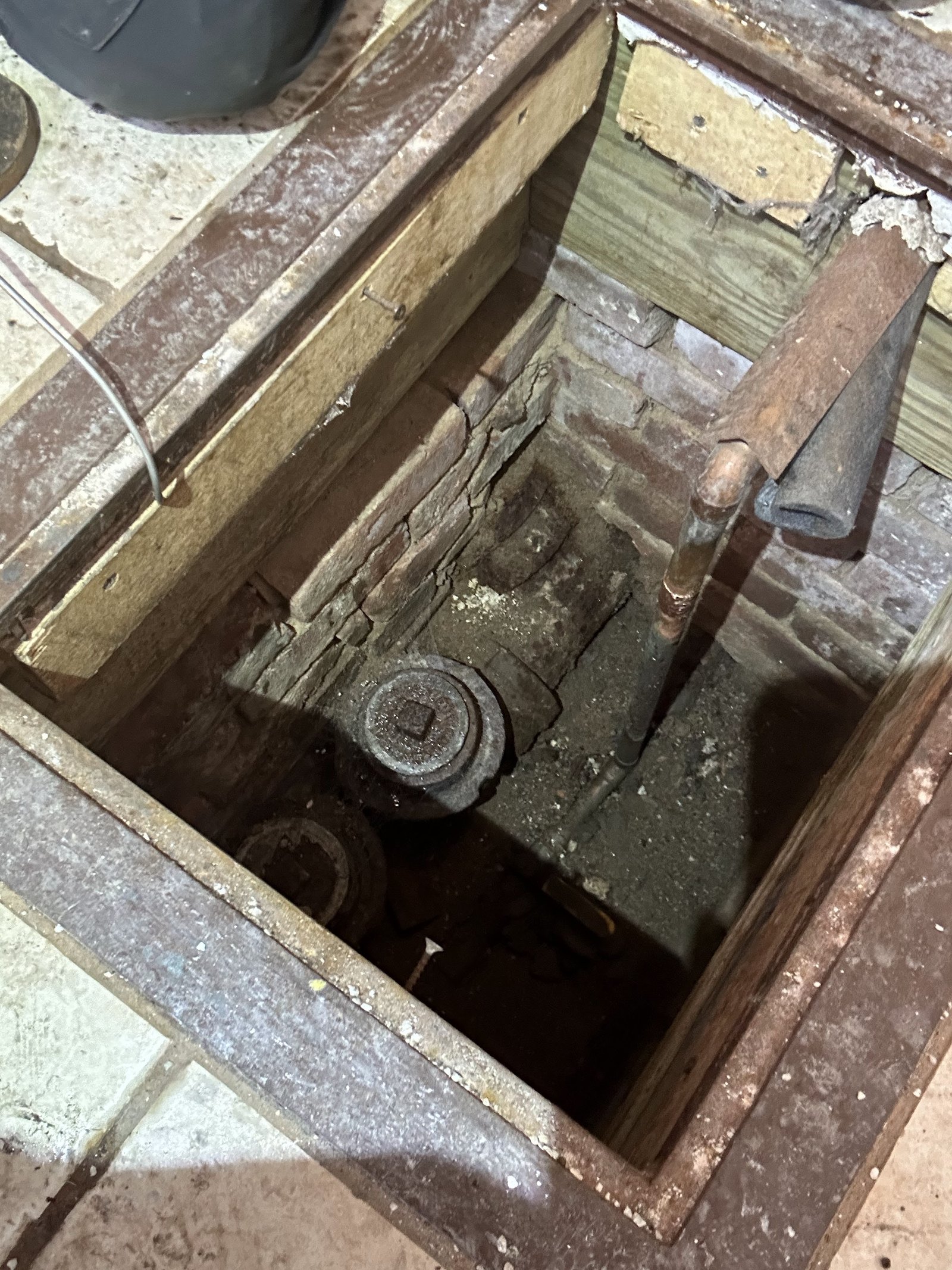 Technician working at a sink drain