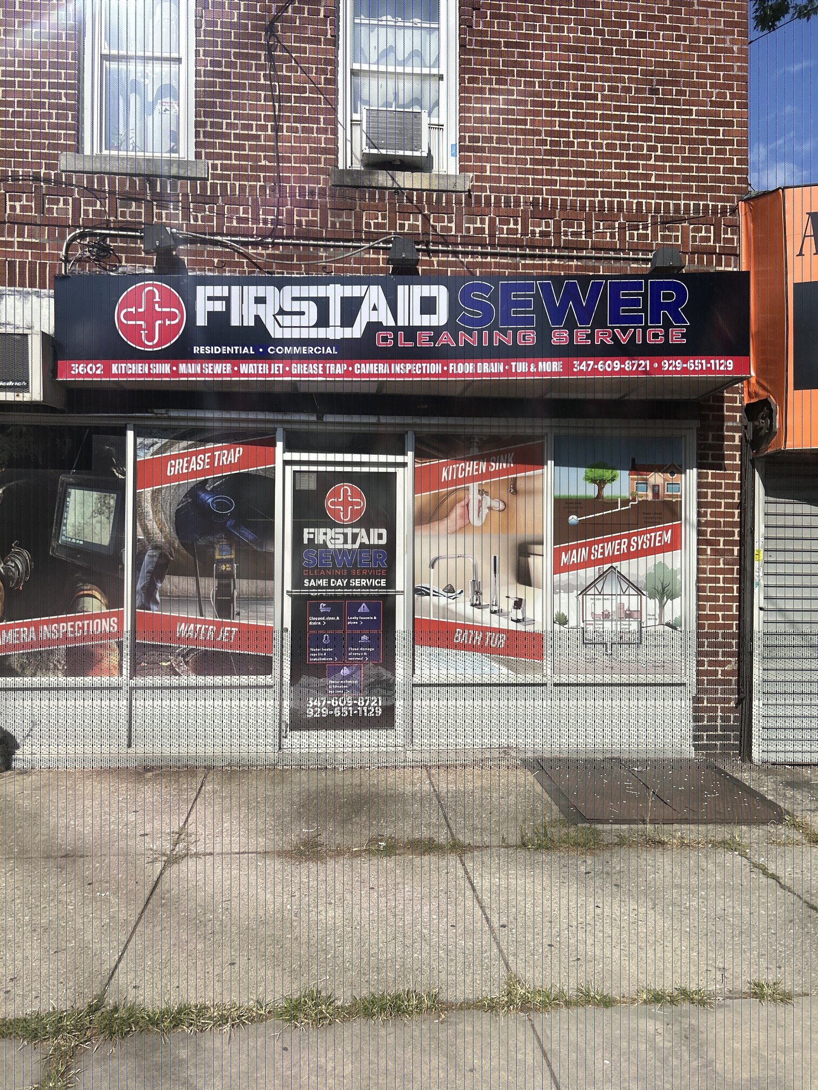 First Aid Sewer Cleaning storefront with service posters